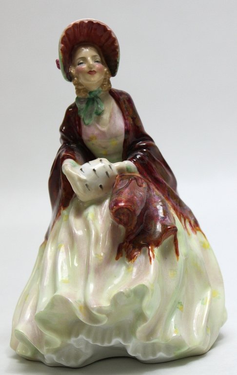 Royal Doultan Figurine Her Ladyship"": Royal Doultan figurine Her Ladyship" with a red and white paisley dress and muff." Measurements: 5 x 5.5" x 8"" Artist: Royal Doultan Style: MidC Modern
