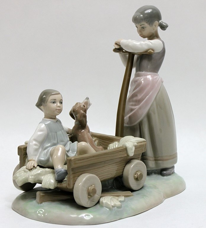Lladro Porcelain Figurine The Wheelbarrow"": Lladro retired porcelain figurine The Wheelbarrow". Sculpted by Julio Fernández and produced from 1973 to 1981," Measurements: 8.75 x 5.5" x 8.5"" Artist: Lladro, Julio Fernández Style: Modern MidC 