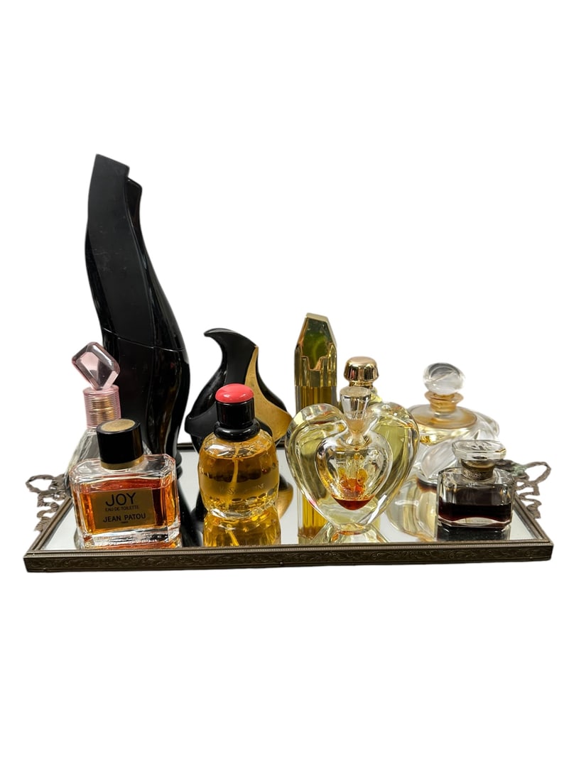 12pc Assorted Perfumes & Mirrored Tray: 12 Pieces of assorted perfumes and mirrored bronze tray. Perfumes include (1) Lalique, with label Made in France on bottom and signed Lalique France, measures 4.5" x 3", (1) Jean Patou, made in France