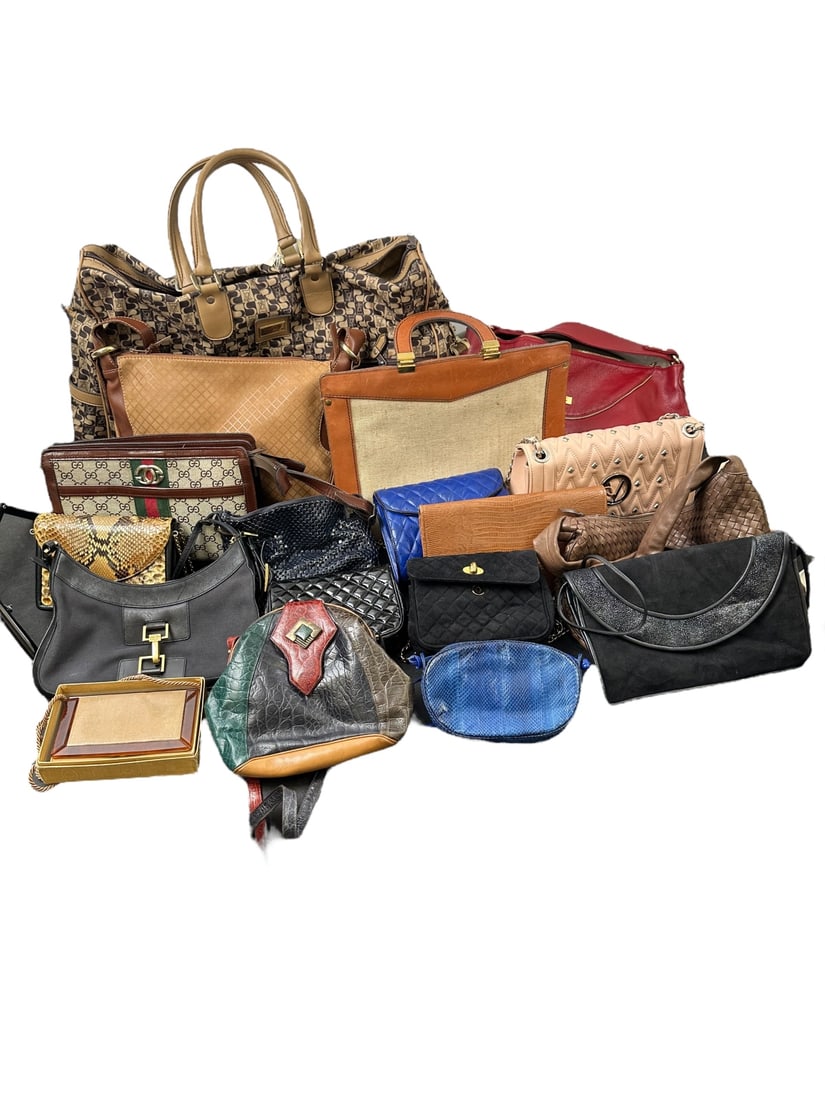 21pc Handbags: 21 Piece handbag collection. (1) Valentino, appears to be right, (2) Gucci, appear faux, (1) ISanti made in Italy large bag measures 24" x 16", (1) Whiting and Davis navy (1) Caprice snakeskin, (2) Di