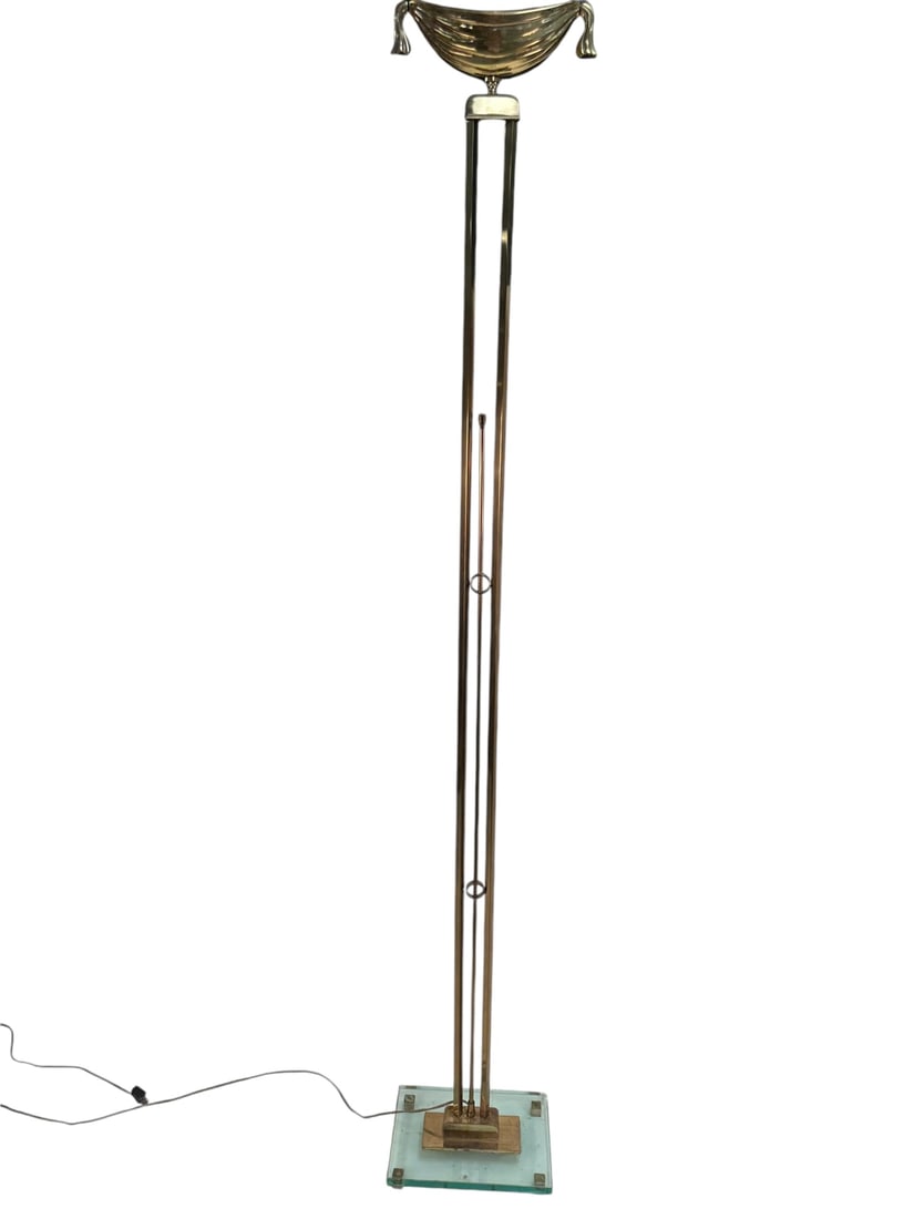 Hollywood Regency Brass & Glass Torchiere: Hollywood regency brass and glass torchiere, center rod controls light fixture. Very good condition, small chips in glass base. Measures 11.5" x 8" x 73".