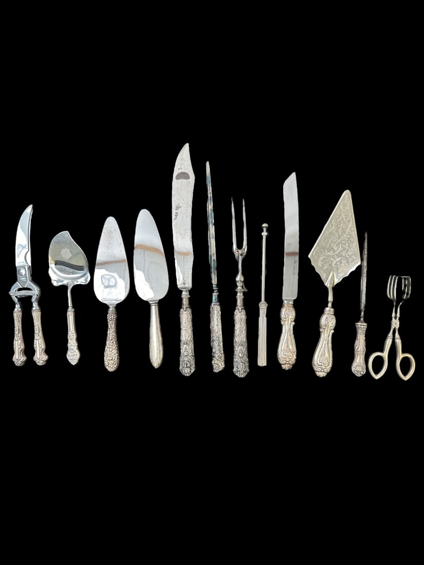12pc Sterling Silver Handle, Stainless Steel Blade: 12 Pieces of Sterling Silver handled serving pieces, (1) Voos bone cutter, measures 10", (1) Rustri Spur cheese plane, measures 8.5", (1) Sheffield England pie server, (1) The Steiff Co pie server, me