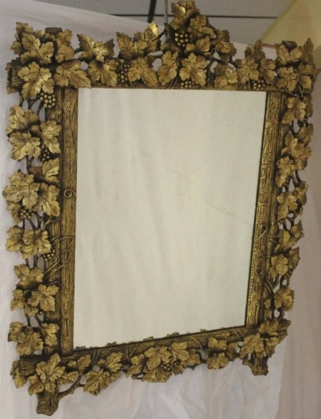 19th Century French Hand Carved Wood Mirror: French gilt wood mirror with a hand carved and detailed grape vine motif. Measurements: 36.5" x 30.25" Style: 19th Century