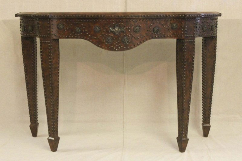 Leather Console w/ Brass Accents: Leather console with brass tacks and brass rosettes. Leather top includes detailed inlay throughout. Measurements: 56.25" x 20" x 36.25" Style: Modern