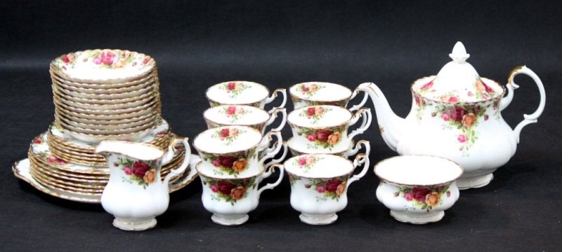Royal Albert Old Country Roses Tea Service: Royal Albert "Old Country Roses" tea set. Set includes teapot that measures 10" x 7' x 8', creamer that measures 5" x 4" x 4.25", sugar dish that measures 4.5" d, 11 tea cups that measure 4" x 3.5" x 