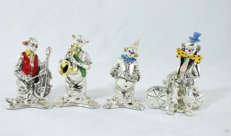 (4) Sterling Nuova Max Art Clown Figurines: Lot of (4) sterling silver and handpainted Nuova Max Art Clowns. Clown on bike (measures 4" x 2.25" x 5"), Clown w/ cello (measures 3" x 1.5" x 4.25"), Clown playing sax (measures 3" x 2" x 4.25"), an
