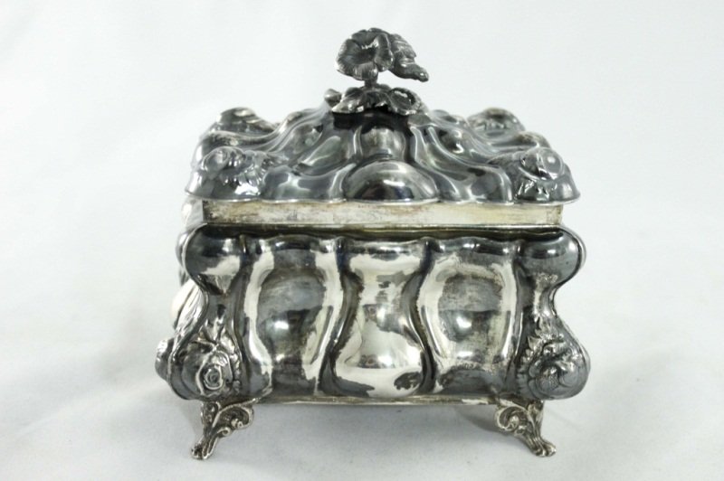 Sterling Silver and Gold Washed Jewelry Casket: Sterling silver jewelry casket with a gold washed interior. Casket has a hand chased floral motif. Marked made in Israel with a 925 sterling silver stamp on bottom. Weight 442g Measurements: 6" x 4.5"