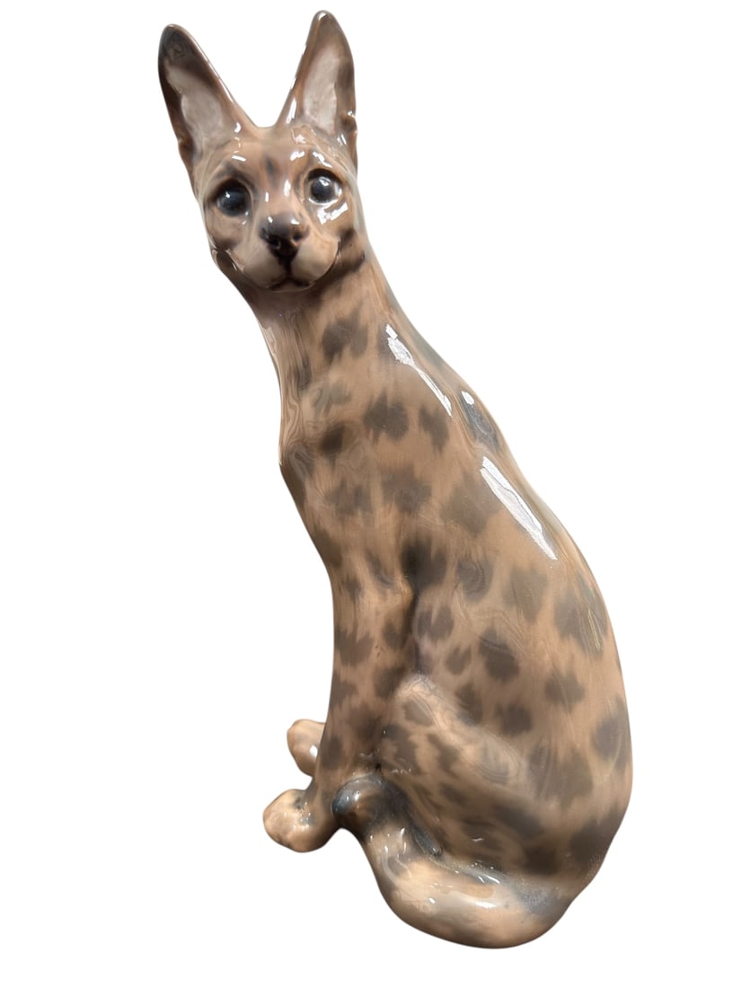 Dahl Jensen Porcelain Serval Model 1014: Dahl Jensen porcelain serval, also known as a wild cat or cheetah, model number 1014. Stamped on bottom. Excellent condition. Measures 5.5" x 4" x 9.65".