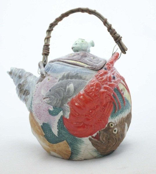 Sumida Japanese Teapot with Sea Creatures: Japanese Sumida Teapot depicting fish, crabs, rays, shells, lobster, eels. Partially glazed and partially bisque. Dimensions: 7" x 4.5" x 8" Period: 19th Century Artist: Sumida