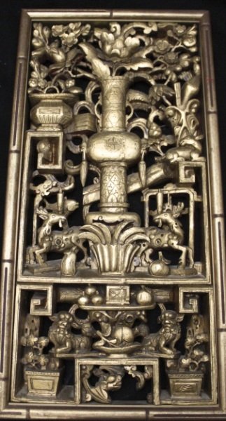 Oriental Hand Carved Wood & Gilt Panel: Oriental hand carved wood and gilt panel with fine detail work throughout depicting different animals and flowers with urns and foo dogs. Dimensions: 14.75" x 29" x 2" Period: 19th Century