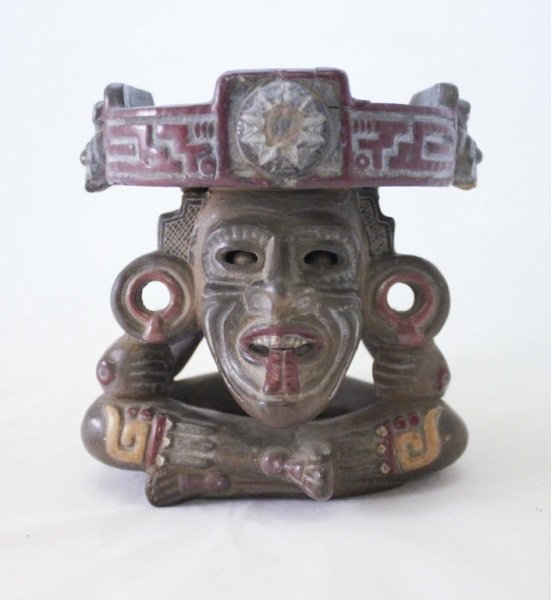 Pre-Columbian Style Painted Terracotta Sacrificial Idol: Pre-Columbian Style Sacrificial Idol made of terracotta with the image of a sacrificial idol sitting down. Painted with red and yellow paint. The clay balls in the eye sockets move around when the ido