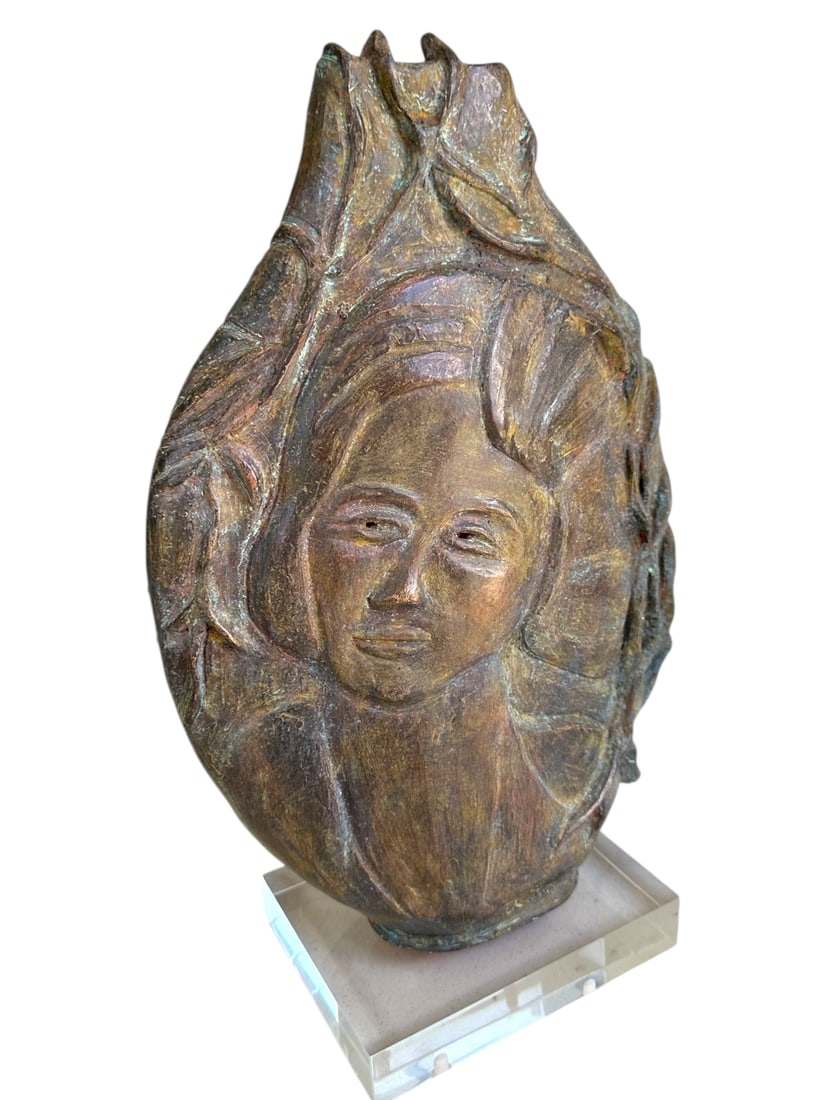 Alice Lumer (American 1920-2012) MatronClay Vase: Alice Lumer (American 1920-2012) clay vase with matron's face on one side and floral decor on the other side, lucite plinth. Signed. Excellent condition. Measures 12" x 5" x 20".