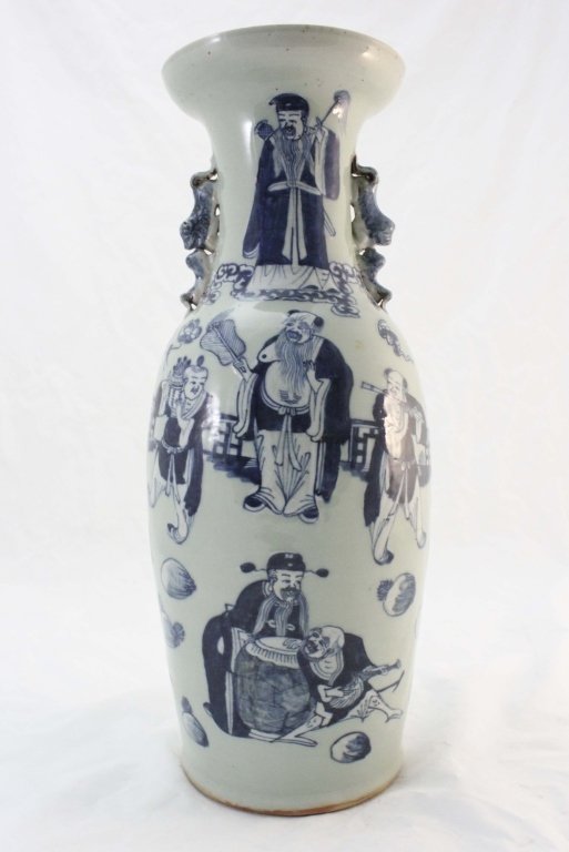 Qing Dynasty Hand Painted Musicians Canton Vase: Qing Dynasty hand painted canton vase with musicians and villagers enjoying the music. Hand formed foo dogs on neck of vase. Measurements: 9.5"d x 23.5" Period: Qing Dynasty
