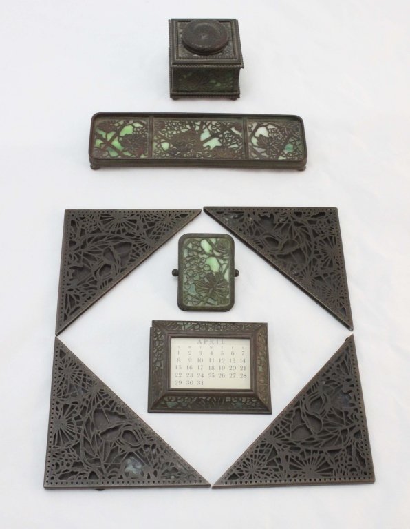 Tiffany Studios New York "Grapevine" 8pcs Desk Set: Tiffany Studios New York "grapevine" 8 pcs. desk set including: 4 blotter corners, measuring 8" x 4", 1 ink well, measuring 3.25" x 3", 1 perpetual calendar, measuring 4.5" x 3.5" x 1.5", 1 pen tray, 