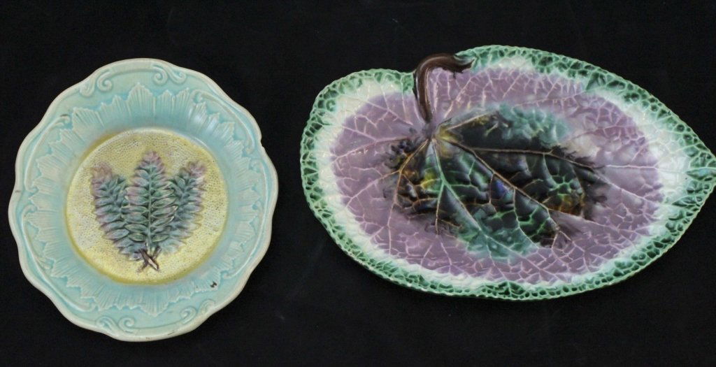 (2) Majolica "Leaf" Plates: Lot of (2) Majolica "leaf" plates: one in the shape of a large leaf measuring 11.1" x 7" x 1.5" and painted in a vibrant green, purple and brown palate. The other is a plate with fern branches on the