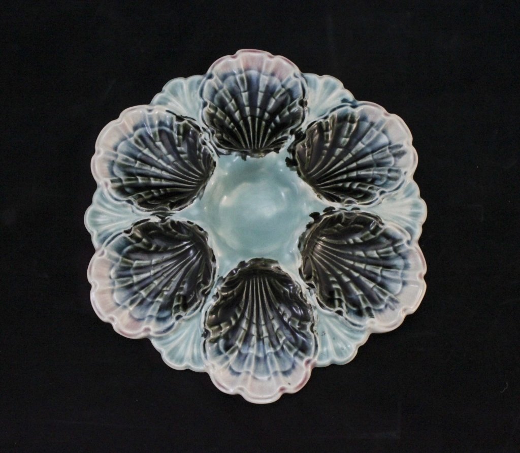 Majolica Longchamp Hand Painted Oyster Plate: Majolica Longchamp hand painted oyster place in vibrant turquoise and black with cream trim around the edge of the oyster slots. Stamped Made in France on back and numbered 4056 and marked isn a "R". 