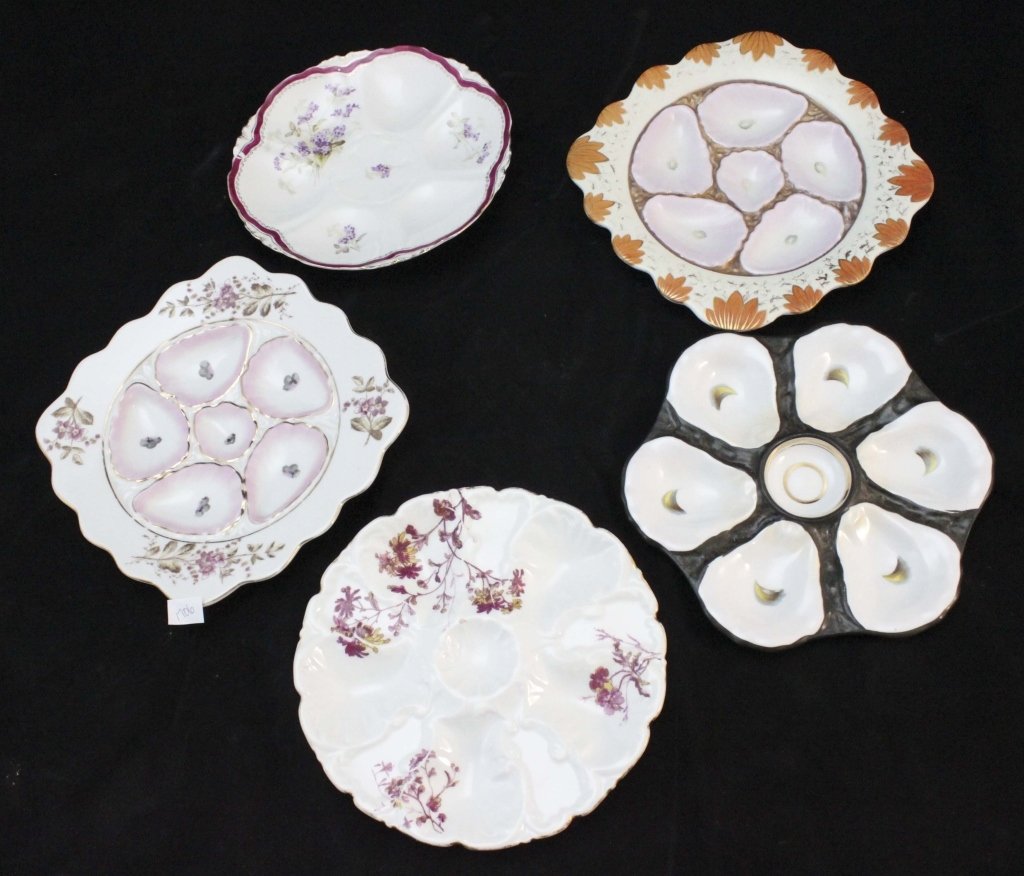 (5) Bavarian & Carlsbad Oyster Plates: Lot of (5) Bavarian and Carlsbad oyster plates. (4) of the plates are Bavarian consisting of the following: 1 plate decorated in orange floral design around edge with pink oyster depression and gilt a