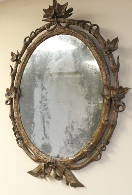 18th Century French Hand Carved Gilt Wood Mirror: 18th Century French hand carved gilt wood mirror with an ivy and bow motif. The wood and mirror are well patinated. Measurements: 26" x 33.5" Period: 18th Century