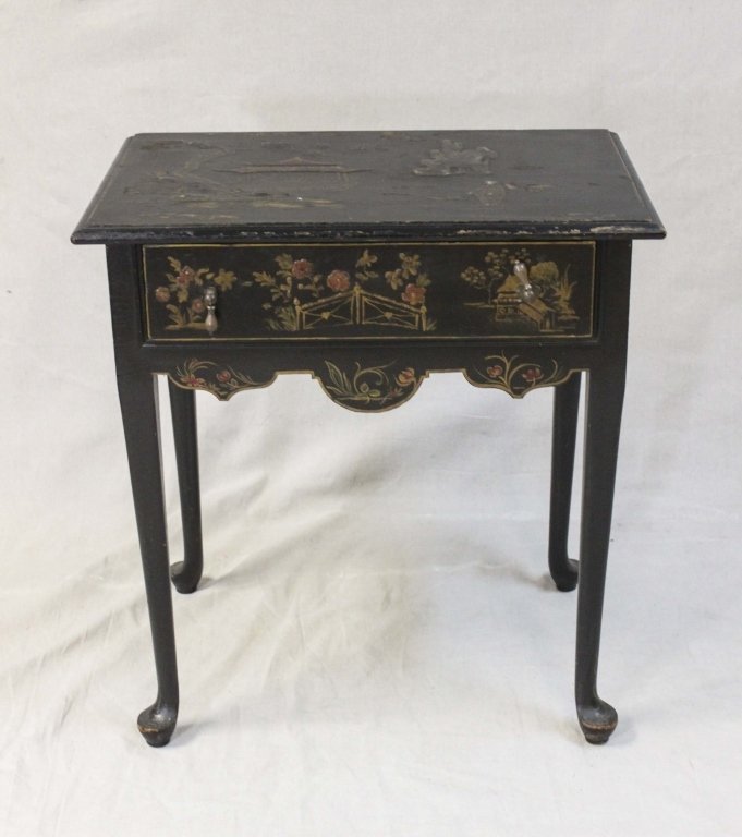 Oriental Black Lacquer Side Table: Hand-painted landscape with oriental motif on a black base. There is a single drawer. Measurements: 18 x 27.5" x 29"" Period: Early 20th Century