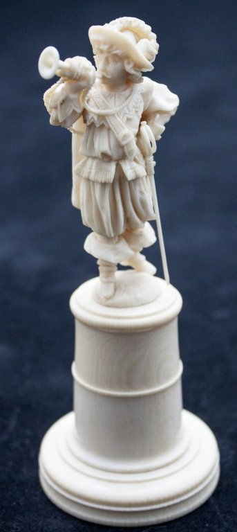 19th C Continental Ivory Carving of Musketeer: Continental Ivory Carving of A Musketeer with a Sword and Trumpet. Figure is Finely Detailed Down to his Spurs. Mounted on an Ivory Plinth. Measurements: 2 dia x 5"" Period: 18/19th Century