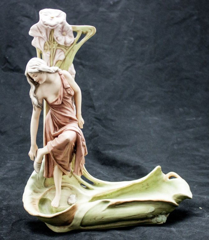 Royal Dux Art Nouveau Sculpture Of Woman Bathing: Royal Dux Art Nouveau Sculpture Of Woman Removing Her Shoes And Bathing Her Feet In A Pond. Repair To Back Of Sculpture And Minor Loss To Her Ring Finger. Measurements: 12 x 5" x 15"" Period: Art Nouv