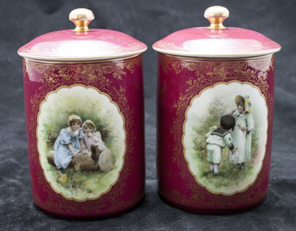 19th C Dresden Cookie Jars w/ Lids & Gilt Details: Pair of 19th Century Dresden Cookie Jars with Lids. Decorated With Gold Gilt and Garden Scene with Children. Minor Wear to Gilt. Measurements: 5 dia x 8.5"" Period: 19th Century Artist: Dresden
