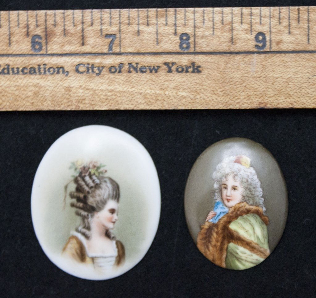 2 Dresden Plaques, Rococo Style Man and Woman: Lot of 2 19th C. Dresden Portrait Plaques, Rococo Style Man and Woman Featuring Georgian Fashion. Hand Painted on Porcelain, Woman is Stamped 25 T. Rococo Woman Measures: 2 Wide x 2.5"" Rococo Man Mea