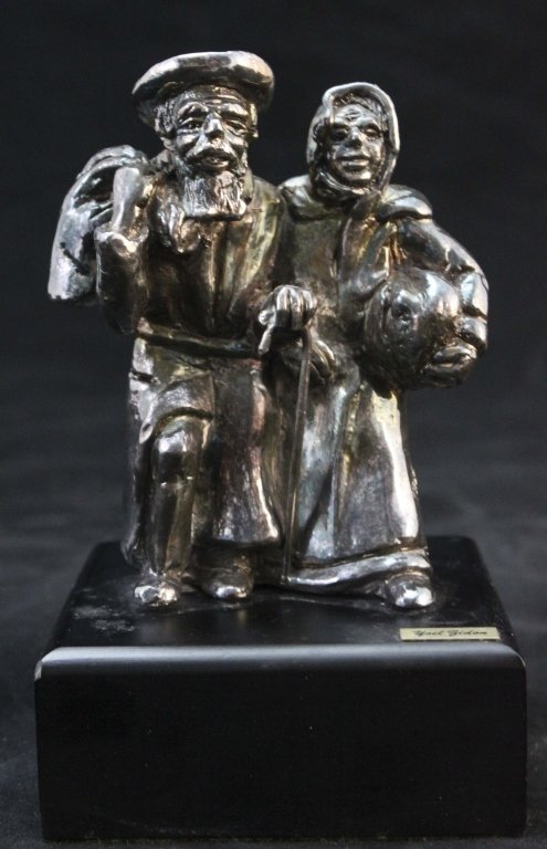 Yoel Zidon Ol Couple" Signed Sterling Sculpture": Yoel Zidon (Israeli) Ol Couple" is a sterling silver Judaica sculpture with intricate and fine detailing in the silver figures. Sculpture is affixed upon a wood base with a artist plaque on the front 