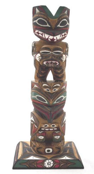 Yellow Cedar Carved Todem Pole by Eric Williams: Yellow cedar carved todem pole. Carved by Eric Williams. Carved on back of todem "CARVED BY ERIC WILLIAMS IN YELLOW CEDAR - HAND CARVED BEAR + HUMAN MASK ^ BABY RAVEN - RAVEN ^ NITAWAT TRIBE" Dimensio