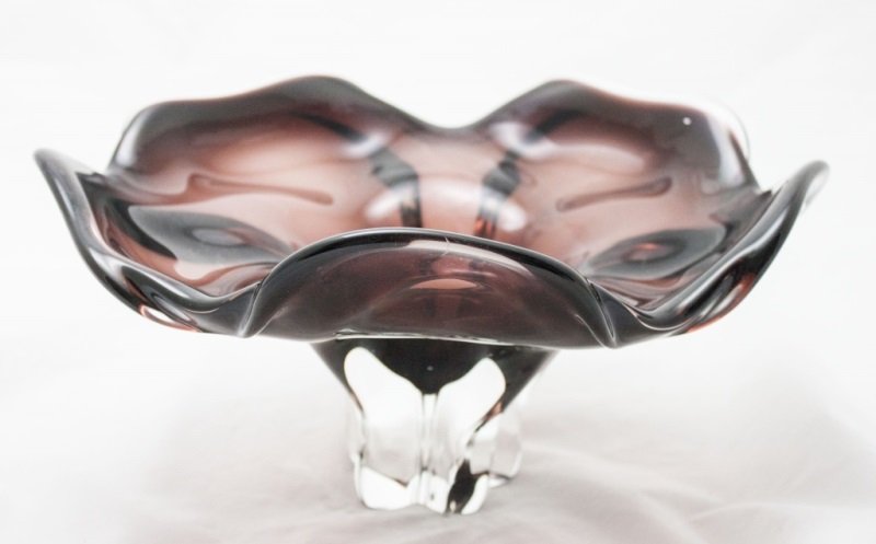 Art Glass Footed Centerpiece Bowl: Art Glass Eggplant or Burgundy Footed Flower Petal Form Centerpiece Bowl. Measurements: 14" Dia x 7" Period: Mid Century Artist: Holmegaard