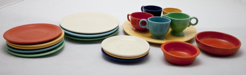 19 Pieces of Fiestaware Plates Cups & Serving Pcs.: 19 pieces of Homer Laughlin Fiestaware includes: 1- 12.25" Serving Plate 3- 9.5" Dinner plates 5 salad plates, 4 cups, 3 Saucers, 2 bowls and a creamer Measurements: See Description Period: Mid centur