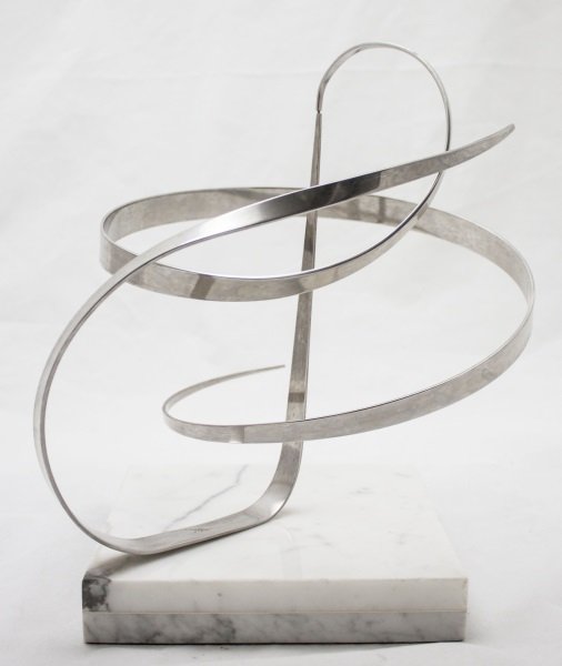 Micheal Cutler Kinetic Abstract Chrome Sculpture: Kinetic Ribbon Form Abstract Chrome Sculpture Signed 'Michael Cutler '77' Measurements: 11" Dia x 14" tall Period: Mid Century, 1977 Artist: Michael Cutler