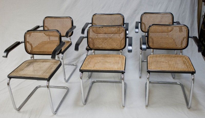6 Gavina Bruer Chairs Dist. by Knoll Made in Italy: Pair of Marcel Breuer Cesca Chairs by Knoll International, second half 20th century, the pattern originally designed in 1928, the caned back and seat on a cantilevered chrome frame, each with the pape