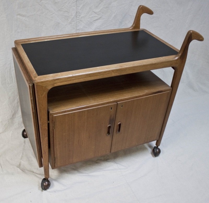 Mid Century Modern Danish Teak Tea Cart: Mid Century Modern Danish teak rolling tea cart Measurements: 38" x 19.5" x 36" Period: Mid Century Artist: Danish