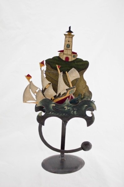 Arts & Crafts Wrought Iron Kinetic Ship Sculpture: Arts and Crafts kinetic sculpture of a ship sailing in the sea. Well painted on wrought iron with a riveted frame. Measurements: 11" x 5" x 23" Period: Arts and crafts