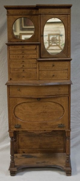 19th Century Oak Barbers or Butlers Cabinet: 19th Century Oak Barbers or Butlers Cabinet with 10 drawers and 2 compartments Measurements: 27.5" x 14.5" x 66.5" Period: 19th Century
