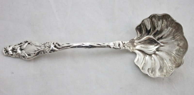 19thC Whiting Lilly pattern Sterling Sauce Ladle: 19th century sterling silver Whiting gravy ladle in the Lilly pattern with shell form decorations. Sterling Silver weight 1.55 oz t Measurements: 2" x 6" Period: Victorian Artist: Whiting
