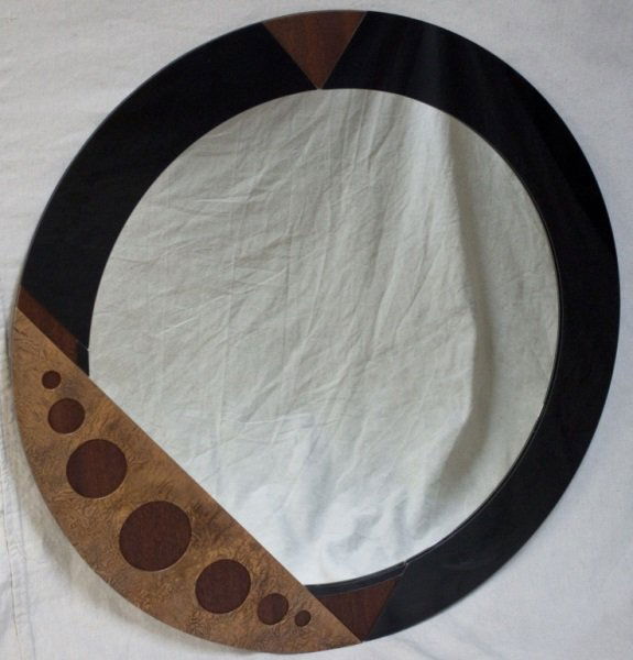 David Marshall Modern Mirror w Geometric Overlay: David Marshall modern mirror with metallic geometric overlay. Paper label. Dimensions: 36" dia Period: 1991 Artist: David Marshall