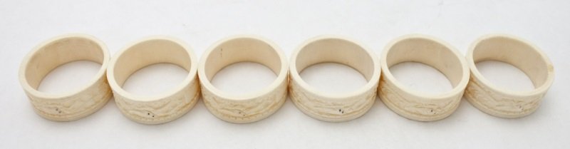 6 Chinese Carved Ivory Dragon Napkin Rings: 6 Chinese hand carved ivory dragon form decorated napkin rings Dimensions: 2" dia x 7/8" Period: Early 20th century