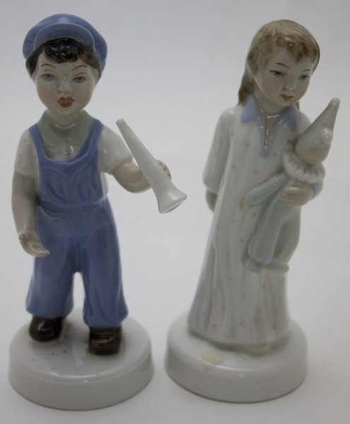 2 Royal Dux Porcelains Boy w Horn & Girl w Doll: 2 Royal Dux porcelain figuresa boy with a megaphone and a girl with her doll. 2.5" dia x 6" 1950's