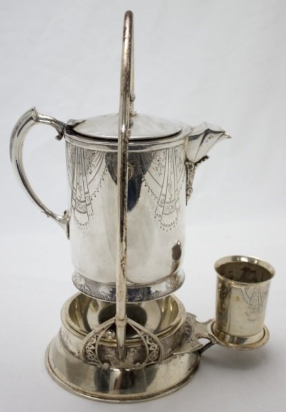 Meriden Co. Quadruple Plate Water Pitcher: Meriden Co. quadruple plate water pitcher with an arctic motif. Decorated with Polar bears, seals, Eskimos and arctic wildlife. 9.5" x 11" x 15.5" 1890's