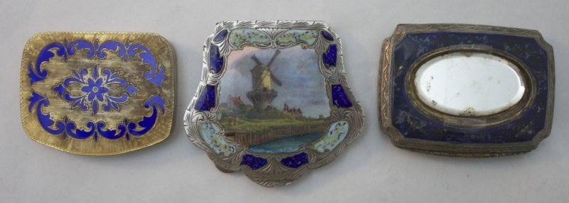 Collection Of Sterling Enameled Compacts: Lot of 3 enameled compacts,includes: Sterling enameled bright cut compact with windmill scene. Missing mirror, marked Sterling Italy. Measures 3.02" x 3" x .26". Sterling enameled bright cut mirrored 
