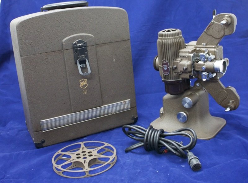 Bell & Howell 16mm Diplomat Filmo Projector: Bell & Howell 16mm Diplomat Filmo Projector in the original case. Immaculate working condition. 14" x 8.5" x15" mid 20th