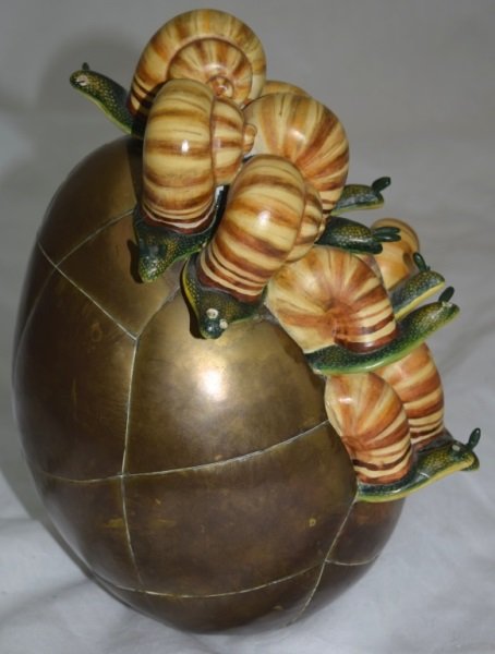 Sergio Bustamante Sculpture Escargot w Brass Egg: Sergio Bustamante sculpture escargot with a brass shelled egg. One snail reattached some antenna missing. 8" x 7" x 11" 1980's