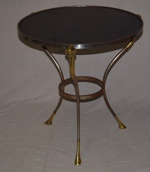 Gueridon Table Marble Top Steel & Brass Frame: Gueridon table with a marble top, steel frame and brass details. Minor surface oxidation to steel. Rams head and feet detailed in brass. 26" dia x 27" 1980's