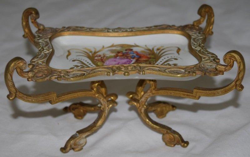 French Painted Bronze & Porcelain Dresser Tray: French hand painted bronze mounted porcelain dresser tray with a severs mark and decorated with a romantic garden scene. 8" x 5" x 4.5" early 20th century