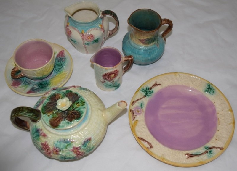 6Pcs Majolica Teapot 3 Creamers Cup Saucer & Plate: 6 Pieces of Majolica with a Teapot measuring 8.5" x 6" x 4.5". There are 3 creamers the largest being 4" dia x 4.5" with a cup/matching 6" saucer and a 8.5" diameter plate 19th century