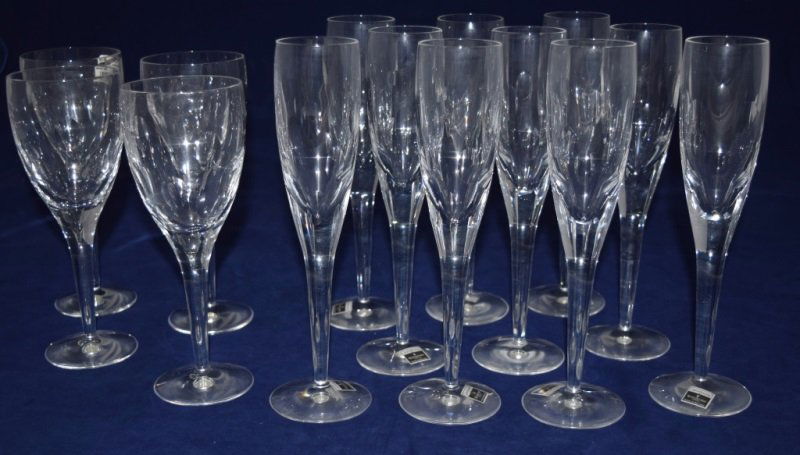 Waterford John Rocha 10 Champagne,10 Water Goblets: Waterford crystal by John Rocha, cut/polished ovals. 10 Fluted Champagne glasses- 10 1/4 in, all with original stickers and 4 matching Goblet/Red Wine glasses- 9 1/8 in. All brand new. Imprint by Wate