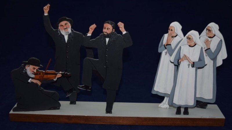 Florence Coleman Wooden Rabbi Sculpture: Florence Coleman wooden sculpture with dancing Rabbi and shy Nuns. 22" x 3" x 12" 20th Century