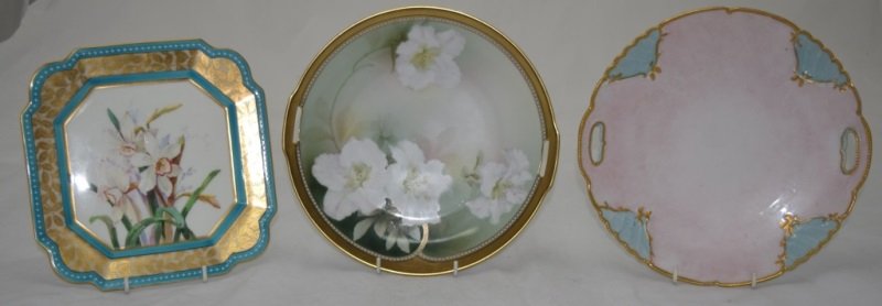 3 Painted Porcelain Dessert Plates RS & Dresden: 3 Hand painted porcelain dessert plates, one 10" dia RS Germany and two Dresden plates one is jeweled and floral painted, measuring 8.5" x 8.5" the other is 10" in dia., some minor wear to gilt see ph